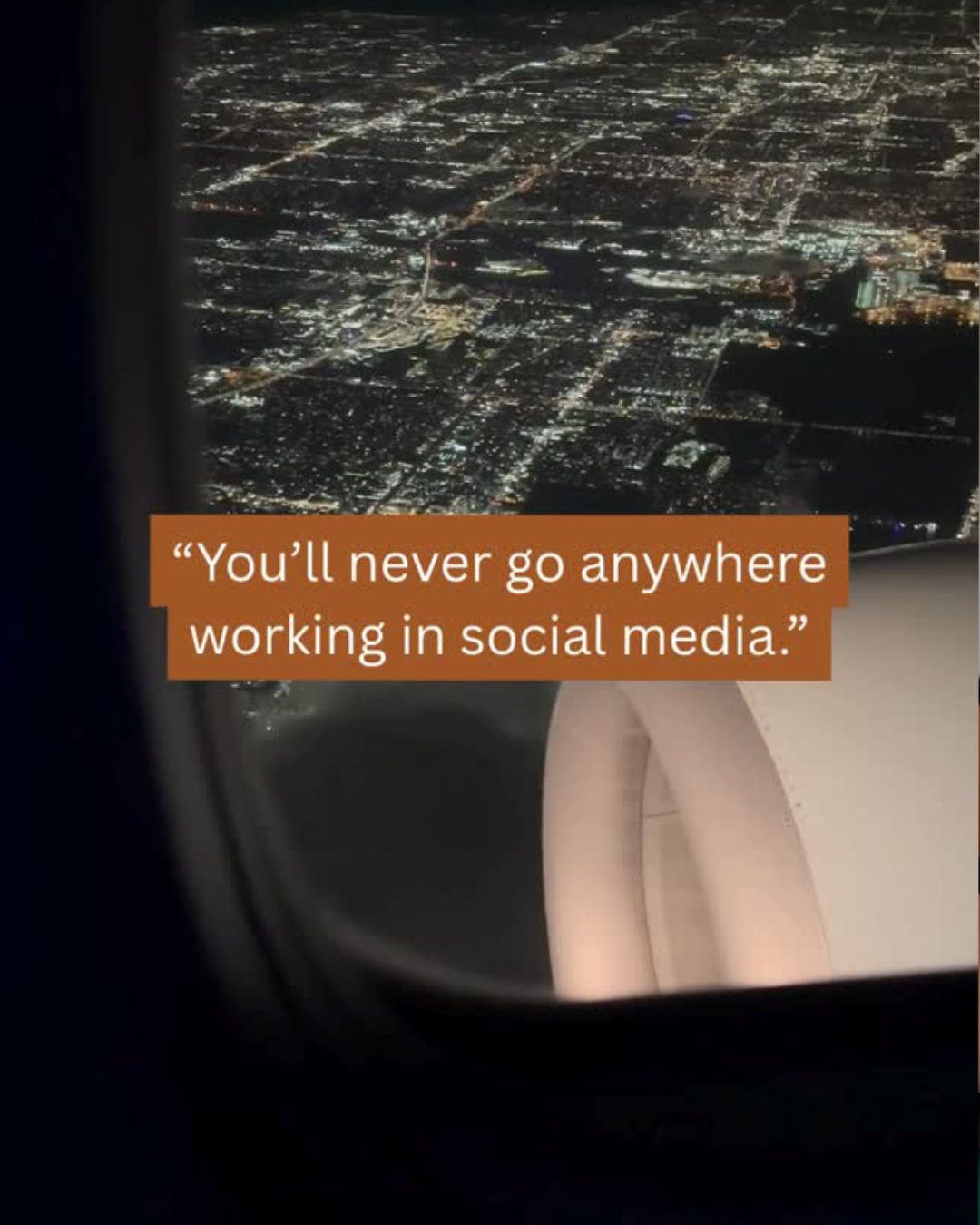 Night flight over illuminated cityscape