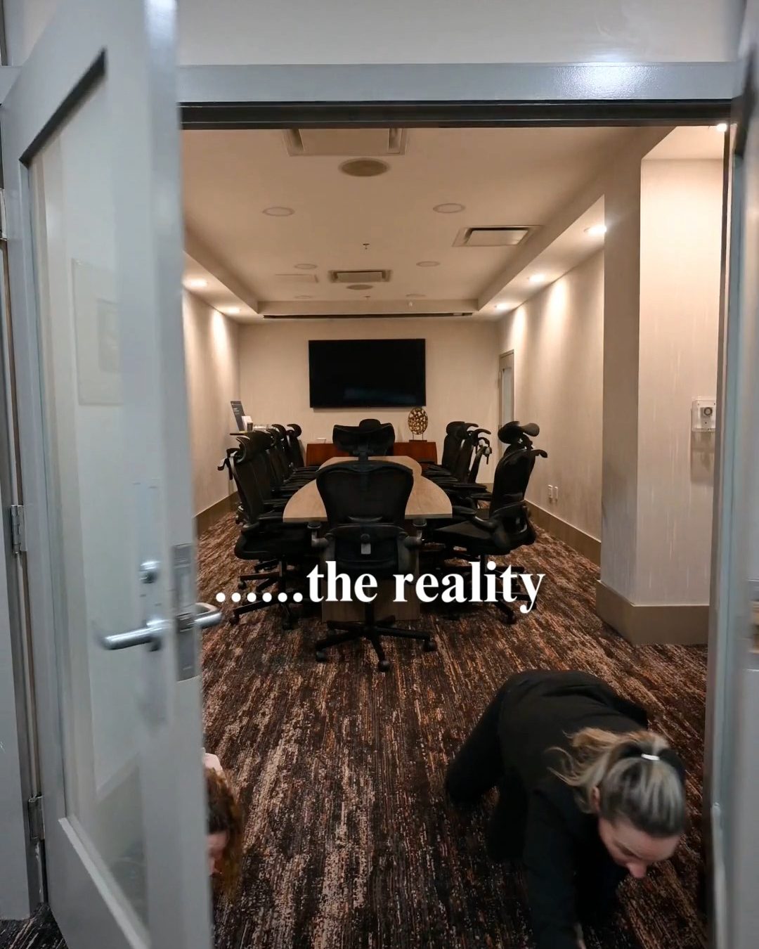 Two people crawling in doorway